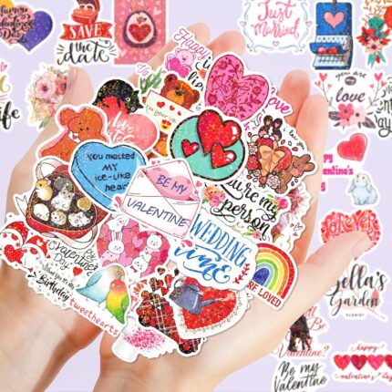 A pile of 100 BestiePal holographic Valentine's Day heart stickers with various romantic messages and patterns, reflecting ra