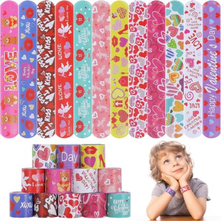A collection of 36 Genuvi Valentine's Day slap bracelets in various designs like hearts, cupids, and gift boxes.