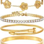 Close-up of four GIVCHO 18K gold plated bangle bracelets with colorless cubic zirconia stones, stacked on a wrist.