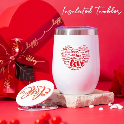 Red heart-shaped gift box open to reveal a 12 oz insulated tumbler, bath bomb, mirror, soap roses, and other spa items.