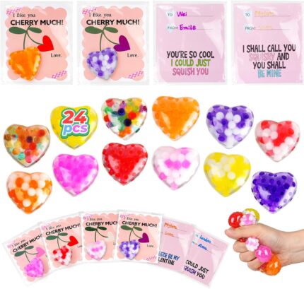 A pile of 24 small, colorful Valentines-themed squishy stress balls featuring various designs like hearts and cute characters