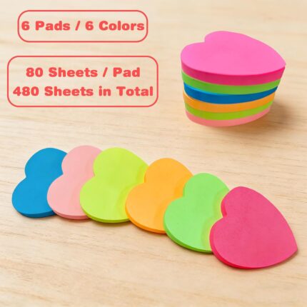A stack of multicolor OHOME heart sticky notes, showcasing dark blue, light pink, neon green, orange, bright green, and hot p