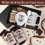 Vabean 5-Piece Coffee Gift Basket with ceramic mug, spoon, spoon rest, coffee candle, and patterned socks in a gift box.