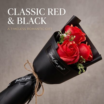 A vibrant red artificial rose bouquet featuring three realistic soap flower blooms with green faux silk leaves, arranged in a