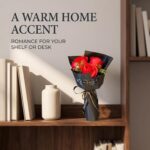 A vibrant red artificial rose bouquet featuring three realistic soap flower blooms with green faux silk leaves, arranged in a
